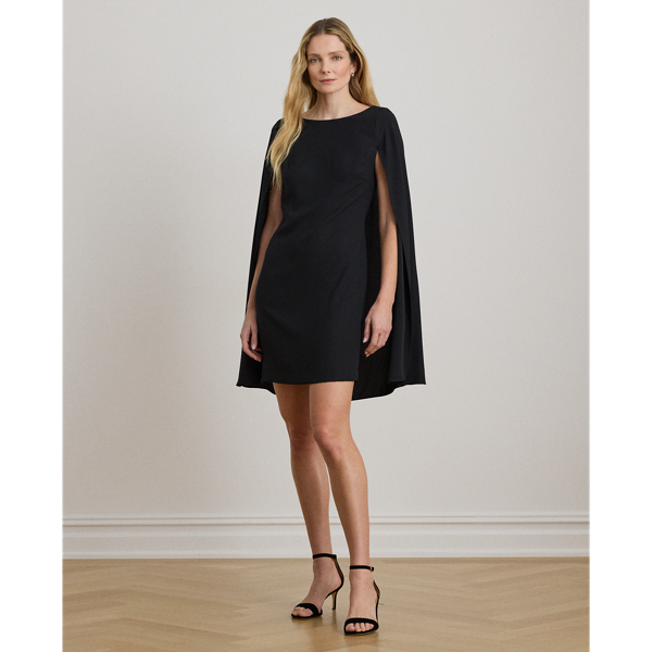 A stylish choice for special occasions, this modern georgette cocktail dress is elevated by a cascading cape, which adds fluid movement to its body-hugging silhouette.