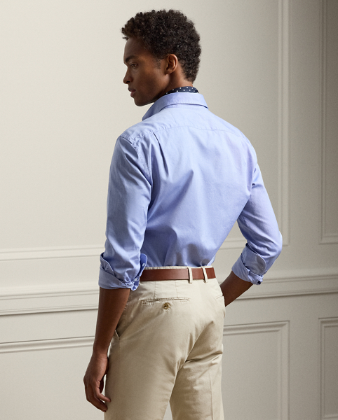 A masterwork of Italian crafting, this shirt reflects the uncompromising standards of Ralph Lauren Lauren Purple Label through its entirely bespoke development. From its distinctive custom-created hue to its precise construction specifications, every element has been meticulously engineered to achieve the pinnacle of sartorial excellence.
