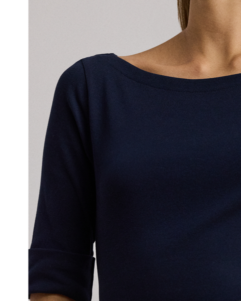 This fit-and-flare midi dress features a flattering boatneck and is crafted with soft, stretch-infused cotton, making it an effortless choice for everyday style.