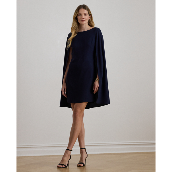 A stylish choice for special occasions, this modern georgette cocktail dress is elevated by a cascading cape, which adds fluid movement to its body-hugging silhouette.