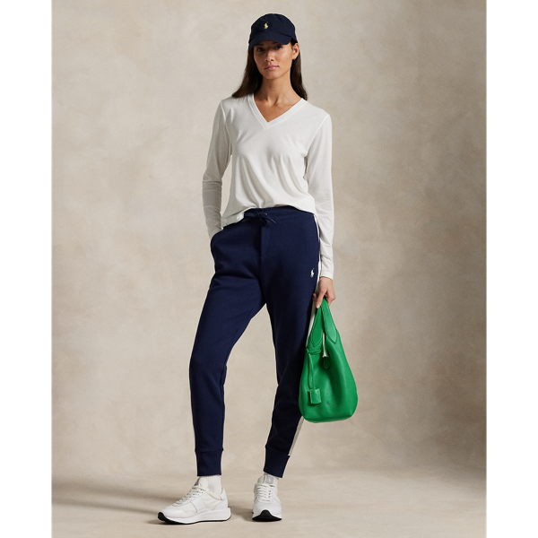 Part of our collection celebrating Wimbledon 2025, these double-knit trousers were designed exclusively for the tournament's ballperson uniform. They feature signature embroidery, including the tournament’s official logo.