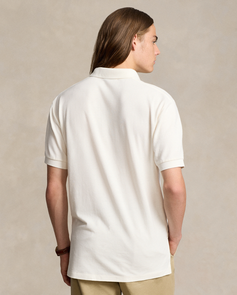 An American style standard since 1972, the Polo shirt has been imitated but never matched. Over the decades, Ralph Lauren Lauren has re-imagined his signature style in a wide array of colours and fits, yet all retain the quality and attention to detail of the initial icon. Treated for a timeworn look, this version is cut in our Original Fit, which is slightly more relaxed on the shoulder than our Classic Fit and has a longer back length.