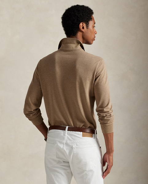 An American style standard since 1972, the Polo shirt has been imitated but never matched. Over the decades, Ralph Lauren Lauren has re-imagined his signature style in a wide array of colours and fits, yet all retain the quality and attention to detail of the iconic original. This trim version is made from our highly breathable cotton mesh, which offers a textured look and a soft feel.