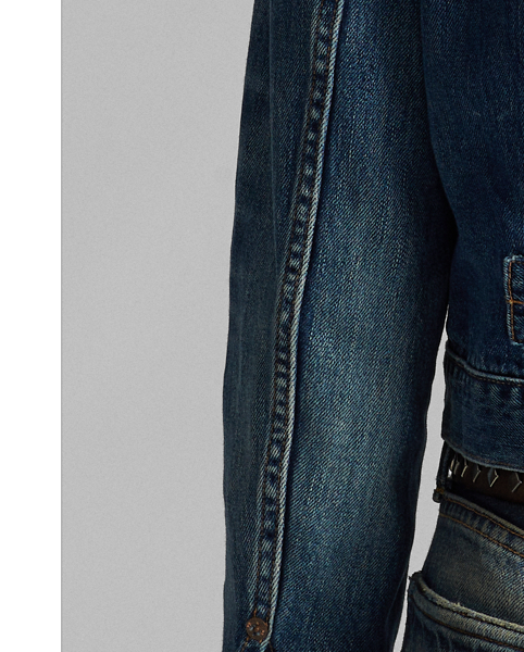 Made from 3x1 denim with a soft hand. Inspired by a '30s workwear jacket. Expansion pleats on the placket. Adjustable buckled tab on the back waist. Stonewashed.