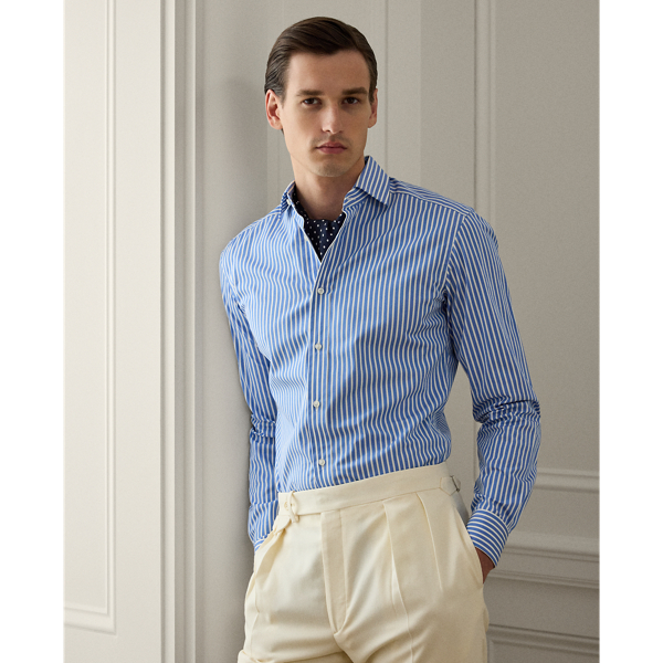 This shirt is masterfully tailored in Italy with lightweight cotton poplin and detailed with genuine mother-of-pearl buttons. It features a bengal-stripe pattern with a saturated blue colour, both of which were custom-developed for Ralph Lauren Lauren.