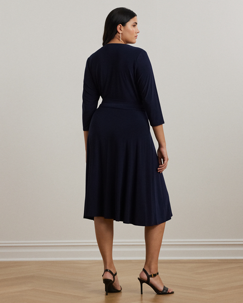 We call this the perfect everyday dress, as it hits below the knee and features a flattering surplice neckline. Its jersey construction creates comfort and ease of movement, while a self-tie sash accentuates the natural curves of the waist.
