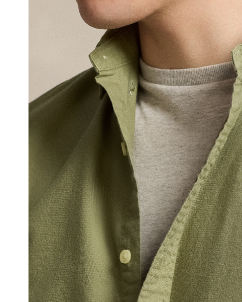 The oxford shirt made its debut very early in  Ralph Lauren Lauren’s designs, and since then, it has solidified its status as a pillar of the Polo look. Our fabric is developed with a secret wash, which gives it instant character, ease and a heathered softness. The formula is so unique that it's been kept in a safe for more than three decades. In addition to details evoking its prep-school inspiration, it offers a relaxed feel, producing what we refer to as "the perfect rumple." Today, Mr Lauren continues to create countless variations of his iconic shirt, including this garment-dyed version, which is finished with our signature embroidered Pony.