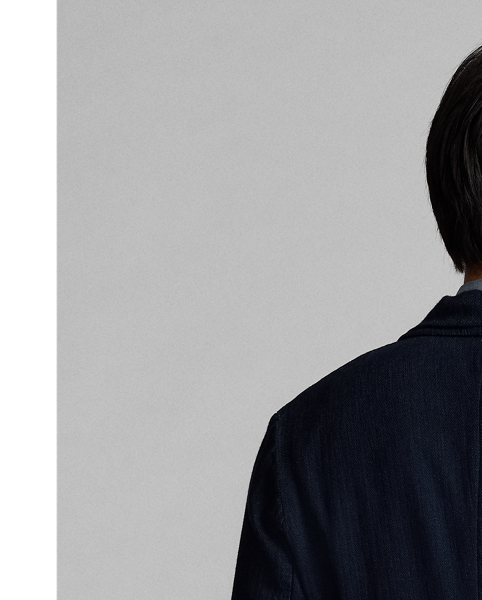 Made with Japanese cotton herringbone that is yarn-dyed with indigo. Half-lined. Corozo buttons.