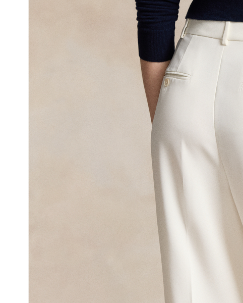 Crafted with fluid matte satin, these straight-leg trousers feature menswear-inspired details, including a pleated front waist and crisp creases along each leg.