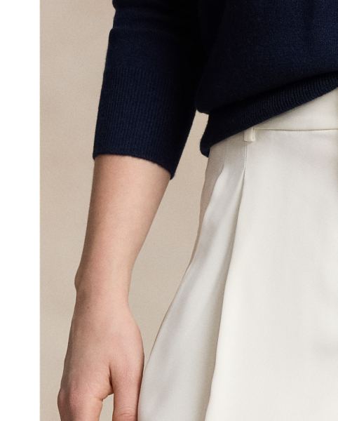 Crafted with fluid matte satin, these straight-leg trousers feature menswear-inspired details, including a pleated front waist and crisp creases along each leg.