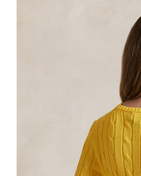 A Polo essential, this slim-fitting crewneck jumper is made with breathable cotton and showcases our signature cable-knit construction.