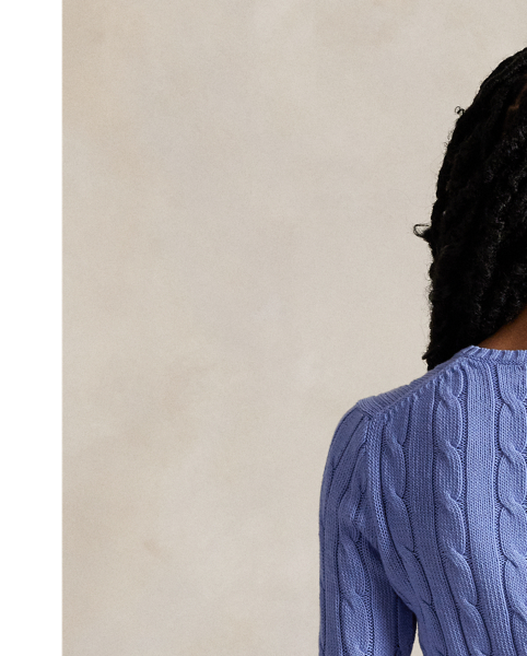 Crafted with combed cotton for a soft hand, this essential V-neck jumper is defined by a cable-knit construct and slim-fitting silhouette. Our embroidered Pony on the chest lends a signature finish.