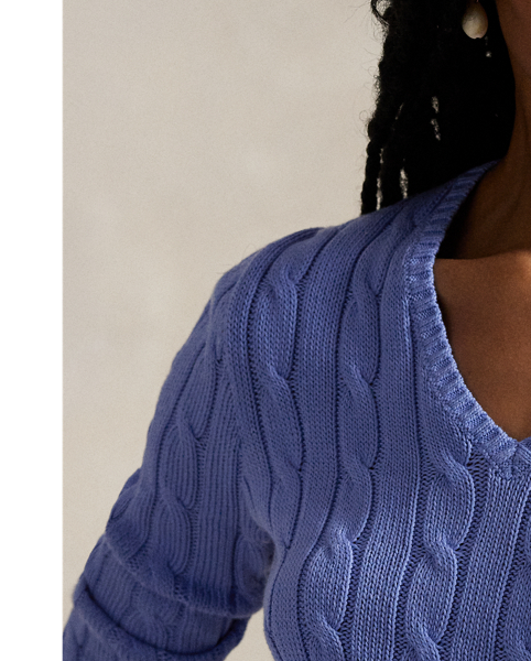 Crafted with combed cotton for a soft hand, this essential V-neck jumper is defined by a cable-knit construct and slim-fitting silhouette. Our embroidered Pony on the chest lends a signature finish.