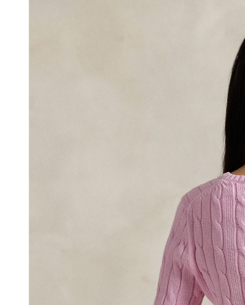 Crafted with combed cotton for a soft hand, this essential V-neck jumper is defined by a cable-knit construct and slim-fitting silhouette. Our embroidered Pony on the chest lends a signature finish.