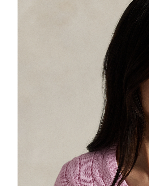 Crafted with combed cotton for a soft hand, this essential V-neck jumper is defined by a cable-knit construct and slim-fitting silhouette. Our embroidered Pony on the chest lends a signature finish.