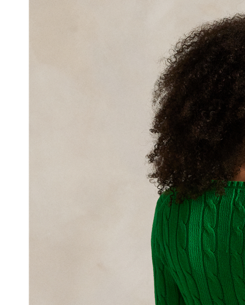 Crafted with combed cotton for a soft hand, this essential V-neck jumper is defined by a cable-knit construct and slim-fitting silhouette. Our embroidered Pony on the chest lends a signature finish.