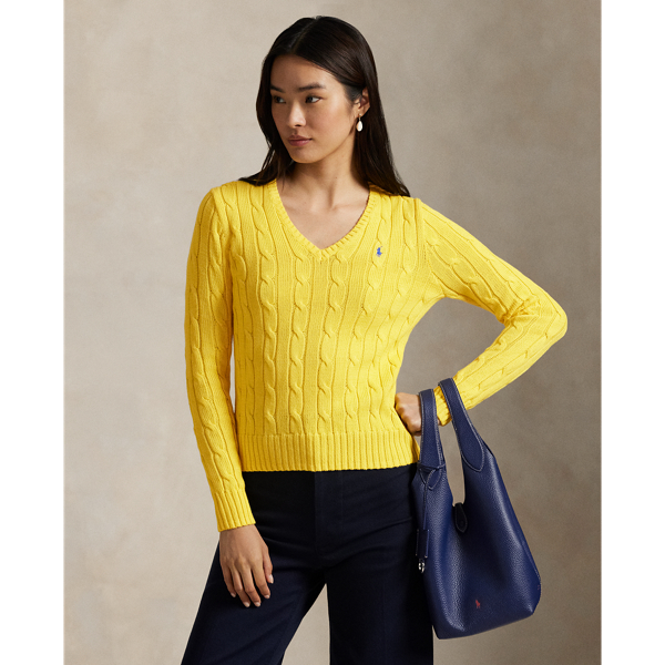 Crafted with combed cotton for a soft hand, this essential V-neck jumper is defined by a cable-knit construct and slim-fitting silhouette. Our embroidered Pony on the chest lends a signature finish.