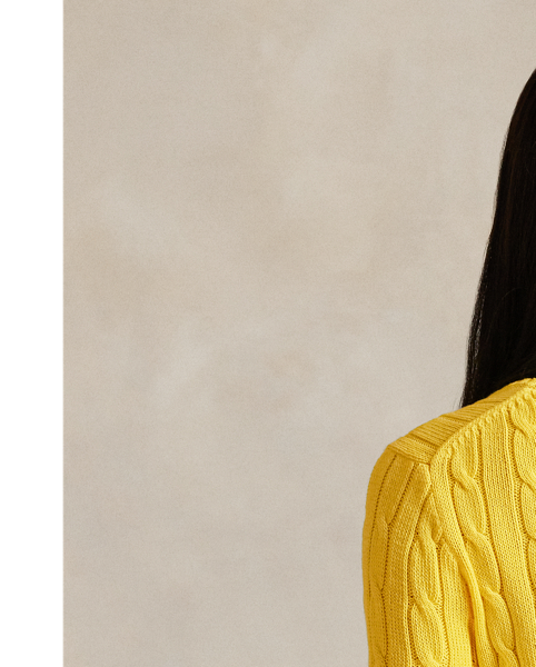 Crafted with combed cotton for a soft hand, this essential V-neck jumper is defined by a cable-knit construct and slim-fitting silhouette. Our embroidered Pony on the chest lends a signature finish.