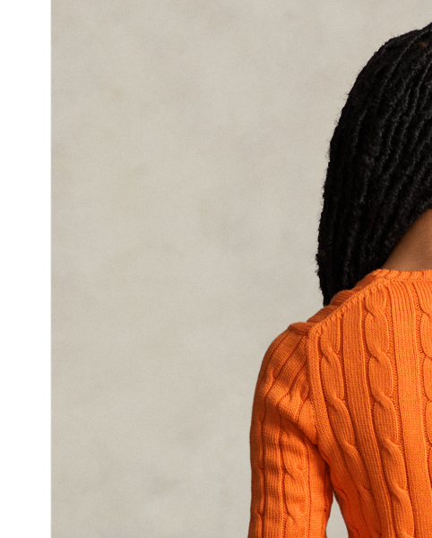 Crafted with combed cotton for a soft hand, this essential V-neck jumper is defined by a cable-knit construct and slim-fitting silhouette. Our embroidered Pony on the chest lends a signature finish.