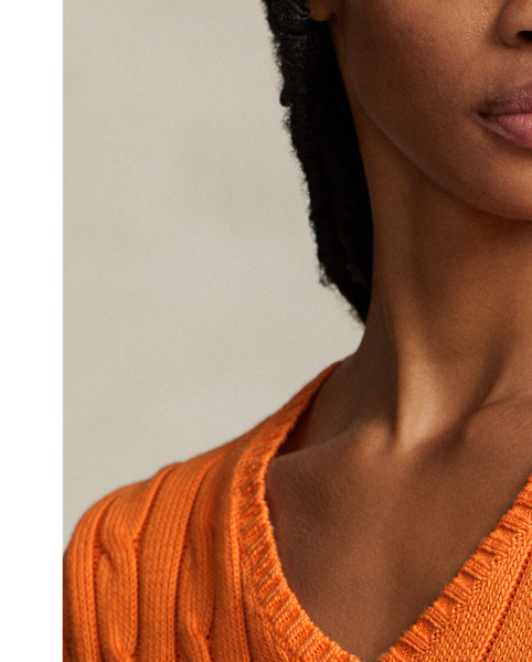 Crafted with combed cotton for a soft hand, this essential V-neck jumper is defined by a cable-knit construct and slim-fitting silhouette. Our embroidered Pony on the chest lends a signature finish.