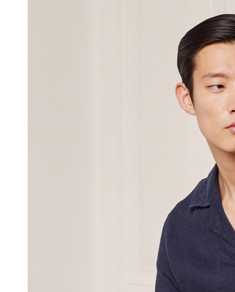 This pyjama set is tailored in Italy using premium linen. Detailed with genuine mother-of-pearl buttons, it is embroidered with Purple Label's signature Art Deco-inspired monogram on the shirt and the coordinating travel pouch.