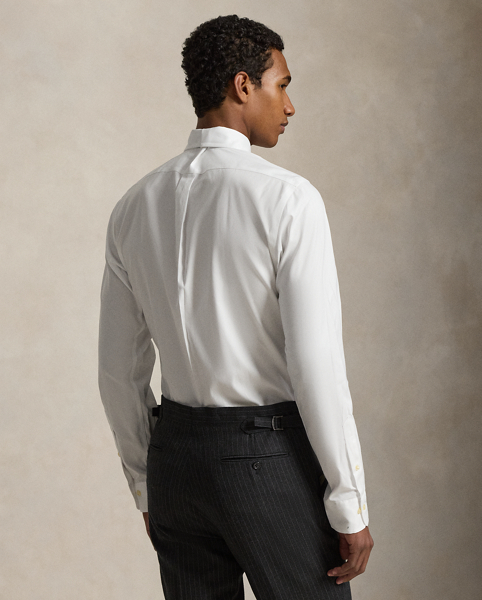 Mercerised cotton and a trim shape put a fresh spin on our iconic pinpoint oxford shirt, while its wrinkle-resistant finish ensures easy care.