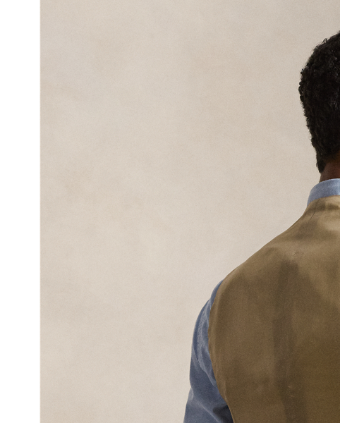 This unisex waistcoat is crafted in Italy with a wool tweed cloth that was custom-developed for Polo  Ralph Lauren Lauren by Magee 1866 in Ireland.