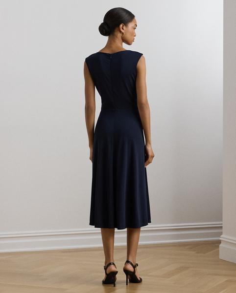 An eye-catching twist-front accent on the bodice serves as the focal point of this stylish cap-sleeve dress, which is crafted with stretch-infused jersey for a soft feel and ease of movement.
