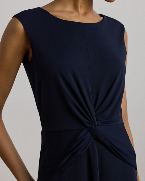 An eye-catching twist-front accent on the bodice serves as the focal point of this stylish cap-sleeve dress, which is crafted with stretch-infused jersey for a soft feel and ease of movement.