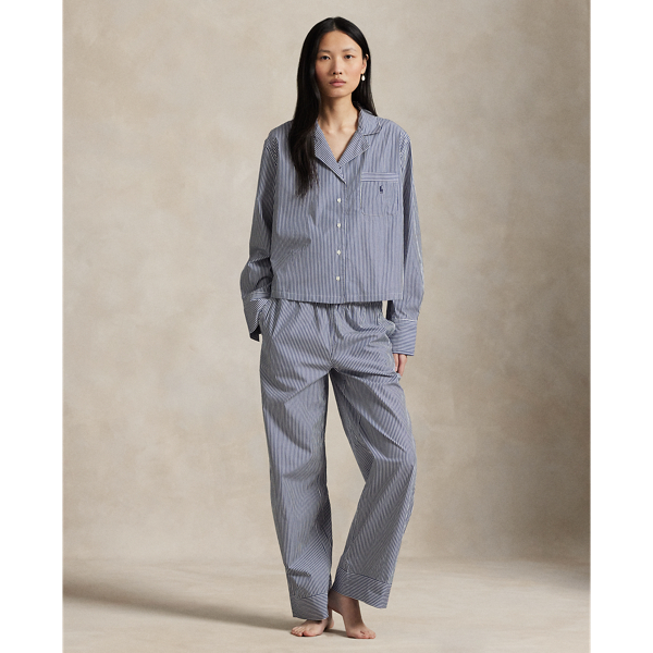 This two-piece pyjama set is designed with classic shirting stripes and embroidered with our signature Pony. Crafted for comfort and longevity, it's made with cotton poplin specially selected for its breathability and soft hand feel that will only get better over time. Ralph Lauren Lauren partners with Better Cotton™ to improve cotton farming globally. Better Cotton trains farmers to use water efficiently, care for the health of soil and natural habitats, reduce use of the most harmful chemicals and implement the principles of decent work.