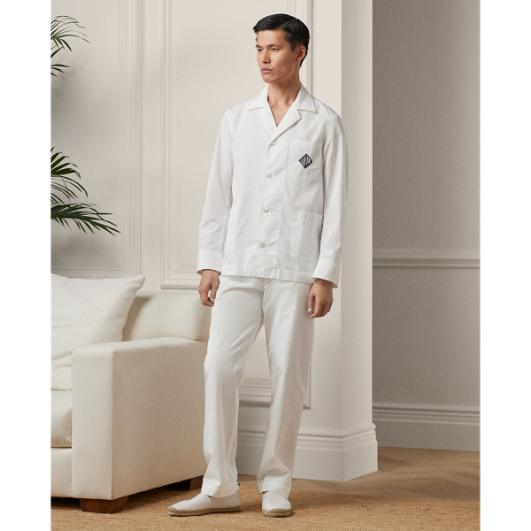 This pyjama set is tailored in Italy using premium cotton. Detailed with genuine mother-of-pearl buttons, it is embroidered with Purple Label's signature Art Deco-inspired monogram on the shirt and the coordinating travel pouch.  Ralph Lauren Lauren partners with Better Cotton™ to improve cotton farming globally. Better Cotton trains farmers to use water efficiently, care for the health of soil and natural habitats, reduce use of the most harmful chemicals and implement the principles of decent work.