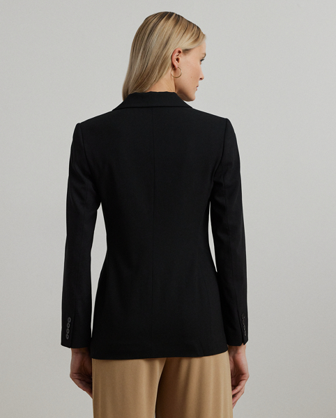A timeless essential, this blazer is made from stretch-infused wool crepe for a polished look and a comfortable feel. A double-breasted silhouette, princess seams and peak lapels amplify its sophisticated sensibility.