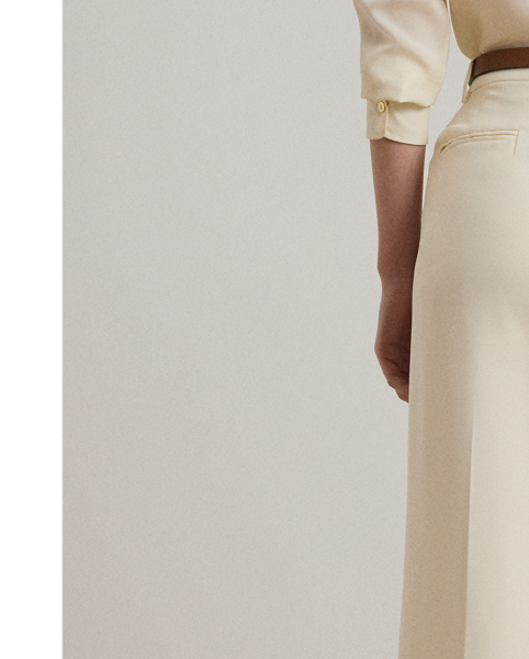 Crafted with luxurious double-faced georgette for a polished look, these wide-leg trousers are a tailored wardrobe essential. Crisp creases and back waist darts enhance their leg-elongating silhouette.