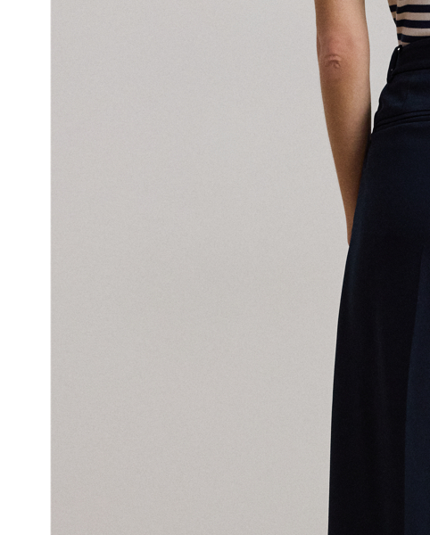 Crafted with luxurious double-faced georgette for a polished look, these wide-leg trousers are a tailored wardrobe essential. Crisp creases and back waist darts enhance their leg-elongating silhouette.