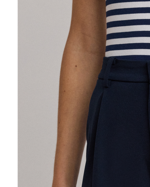 Crafted with luxurious double-faced georgette for a polished look, these wide-leg trousers are a tailored wardrobe essential. Crisp creases and back waist darts enhance their leg-elongating silhouette.