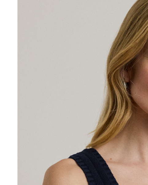 Crafted from gassed cotton for a soft feel, this cable-knit sleeveless jumper serves as an essential transitional piece into spring.