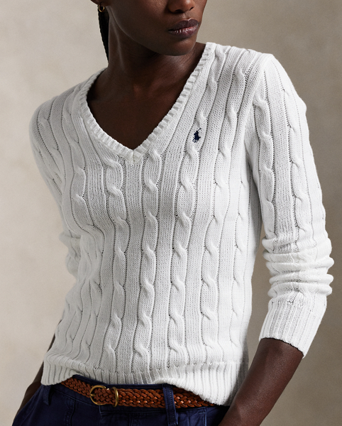 Crafted with combed cotton for a soft hand, this essential V-neck jumper is defined by a cable-knit construct and slim-fitting silhouette. Our embroidered Pony on the chest lends a signature finish.