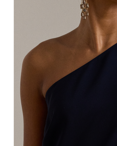 An elegant choice for your next occasion, this statuesque one-shoulder jumpsuit is defined by a cascading cape. Its luxurious georgette fabrication creates fluid movement with each step.
