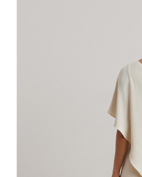 An elegant choice for your next occasion, this statuesque one-shoulder jumpsuit is defined by a cascading cape. Its luxurious georgette fabrication creates fluid movement with each step.