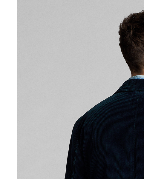 Made with wide-wale cotton corduroy from Japan. Dyed with indigo and washed. Workwear-inspired details. half-lined. Finished with corozo buttons.