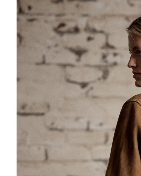 Sueded sheepskin jacket with a waist-length fit. Accented with chest pockets and Western-style yokes. Snapped placket and cuffs.