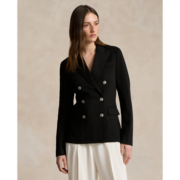 Soft yet structured, this double-breasted blazer is designed with a knit shell, shoulder pads and a partial cupro lining. It's adorned with signature engraved buttons for a heritage-inspired finish.