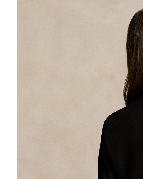 Soft yet structured, this double-breasted blazer is designed with a knit shell, shoulder pads and a partial cupro lining. It's adorned with signature engraved buttons for a heritage-inspired finish.