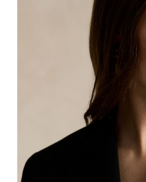 Soft yet structured, this double-breasted blazer is designed with a knit shell, shoulder pads and a partial cupro lining. It's adorned with signature engraved buttons for a heritage-inspired finish.