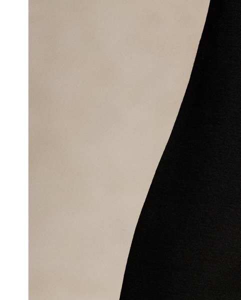 Soft yet structured, this double-breasted blazer is designed with a knit shell, shoulder pads and a partial cupro lining. It's adorned with signature engraved buttons for a heritage-inspired finish.