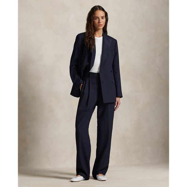A pleated front construction and tonal silk faille side stripes define the tuxedo-inspired style of these wide-leg wool trousers.