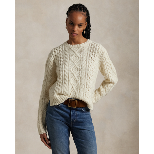 Crafted with chunky Italian yarn that's spun with an alpaca-and-wool blend, this crewneck jumper is designed for a soft hand to complement the raised texture of its classic Aran-knit pattern.