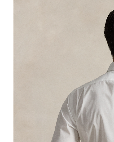 This tuxedo shirt is crafted from lightweight cotton poplin and distinguished by a contrasting double-faced bib on the front. French cuffs and genuine mother-of-pearl buttons complete this sophisticated style.