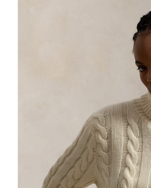 This unisex version of our iconic cable-knit roll neck jumper is knit with an Italian wool yarn that’s spun with a hint of cashmere.