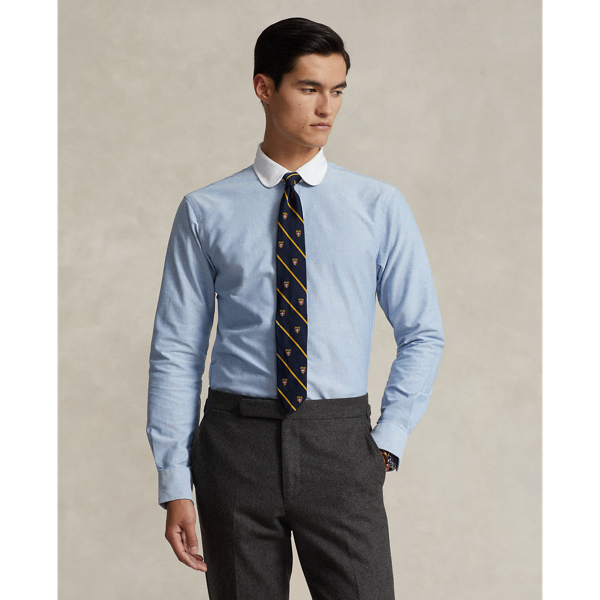 In our signature oxford cloth, this shirt achieves a polished Polo look with its contrasting club collar and genuine mother-of-pearl buttons.